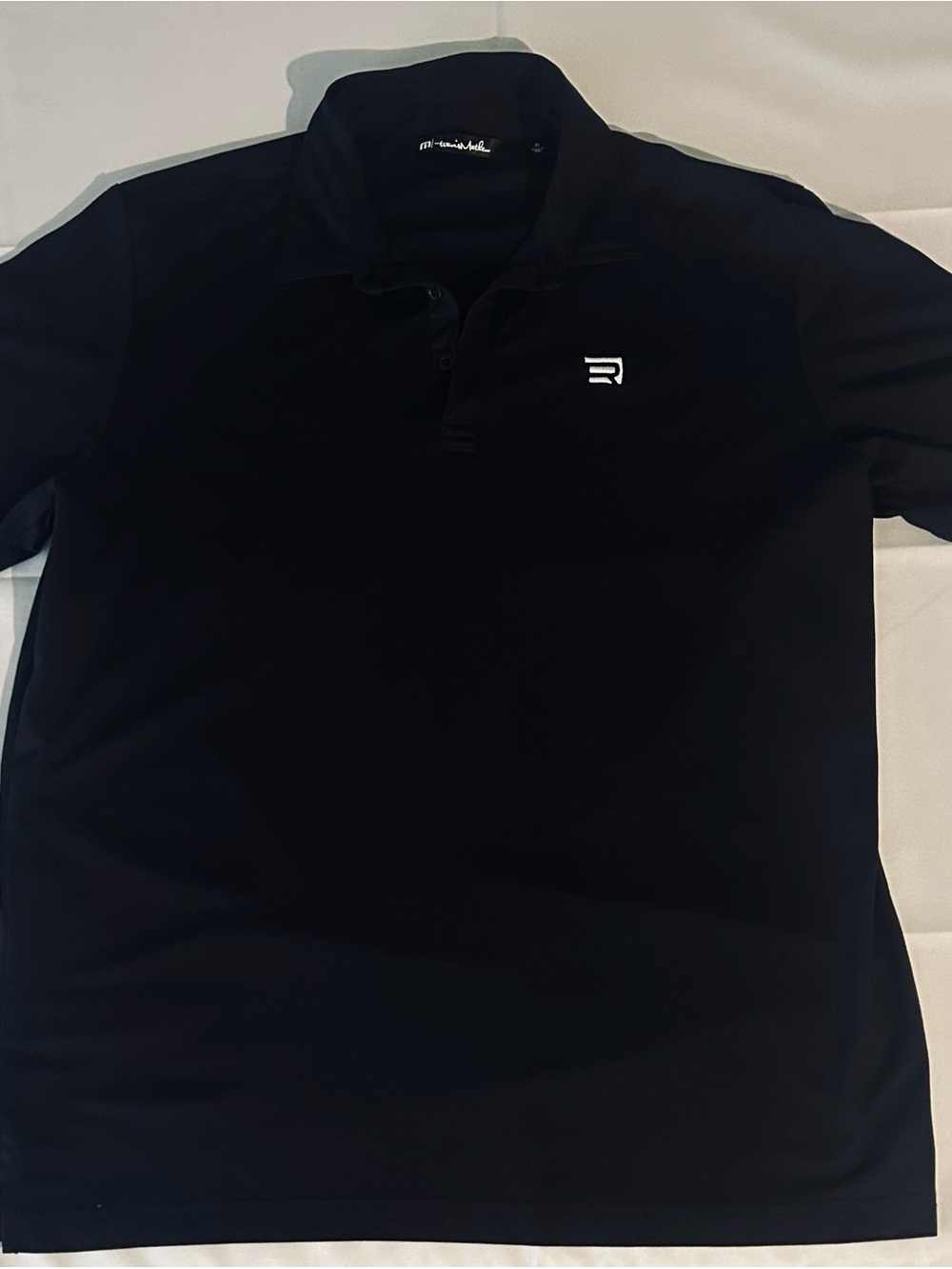Travis Mathew Black Polo with White Chest Logo